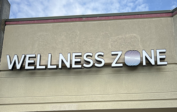 wellness zone studio logo and building front